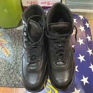 Woman’s high top postal boots